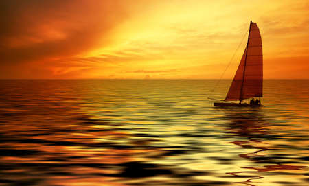 Sailboat against a beautiful sunsetの写真素材
