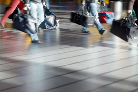 people with luggage at the airport (Blurry!)の写真素材