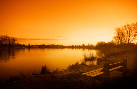 Sunrise, early in the morning at a lakeの写真素材
