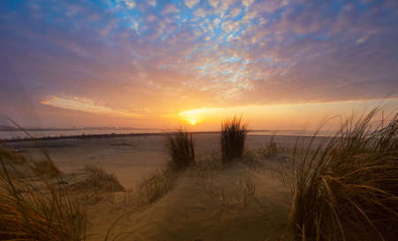 Beautiful sunset , sand dunes and oceanの写真素材