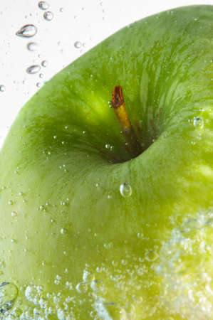 fresh green apple and water bubblesの写真素材
