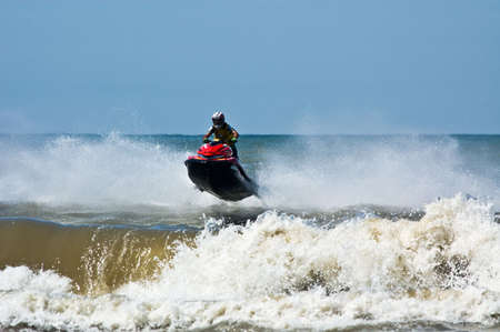 extreme  jet-ski watersports with big wavesの写真素材