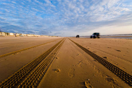 cars driving on the beach の写真素材