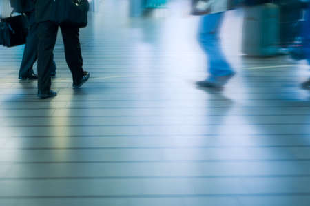 people traveling at the airport ( motion blur)の写真素材