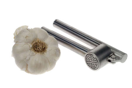 fresh garlic and press isolated on a white backgroundの写真素材
