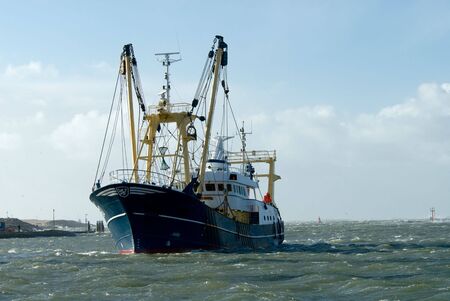 fishing ship during a storm in harbor 
