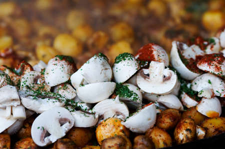 close up of mushrooms with herbs ready to cookの写真素材