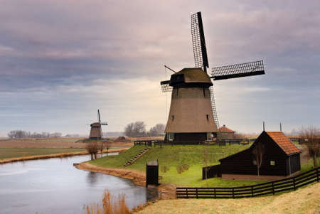 beautiful winter windmill landscape in the Netherlandsの写真素材
