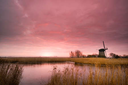 beautiful winter windmill landscape in the Netherlandsの写真素材