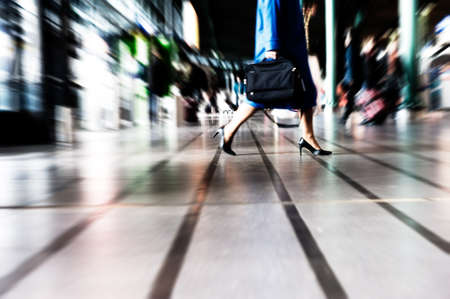 people traveling at the airport ( motion blur)の写真素材