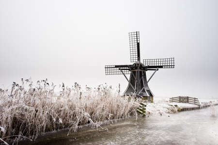 beautiful winter windmill landscape in the Netherlandsの写真素材