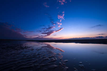 Sunset on the beach in the netherlandsの写真素材