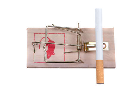 conceptual image of  a cigarette on a mouse trap isolated on a white backgroundの写真素材
