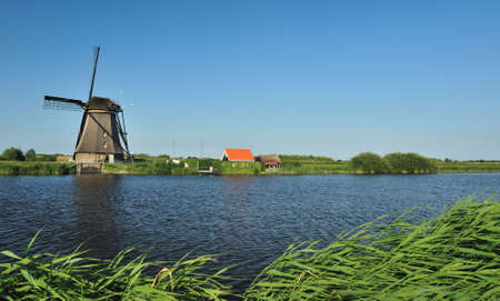 beautiful windmill landscape at kinderdijk in the netherlands near Rotterdamの写真素材