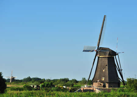 beautiful windmill landscape at kinderdijk in the netherlands near Rotterdamの写真素材