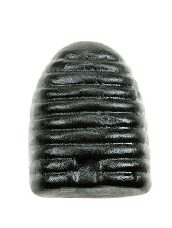 typical dutch honey liquorice candy isolated on a white backgroundの写真素材