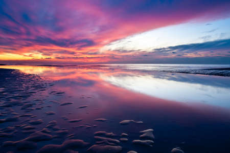 wild sunset at the dutch coast in callantsoog the Netherlandsの写真素材