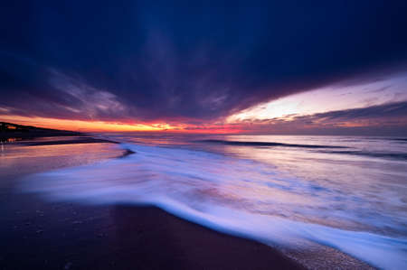 wild sunset at the dutch coast in callantsoog the Netherlandsの写真素材