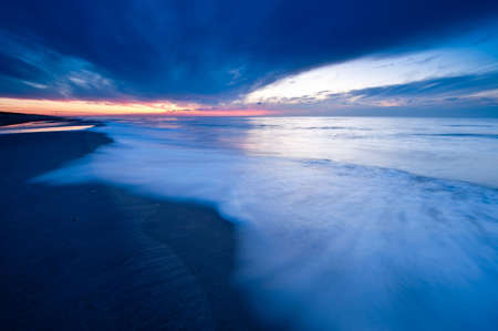 wild sunset at the dutch coast in callantsoog the Netherlandsの写真素材