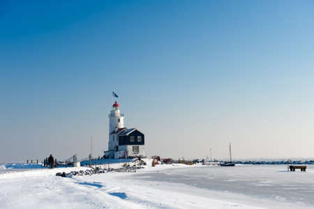 Lighthouse in winter (Marken a small village near Amsterdam)の写真素材