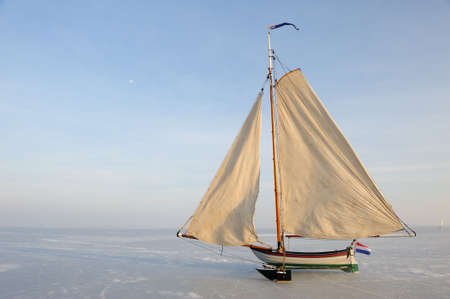 Traditional Ice Yacht  on the frozen lake (gouwzee Between Edam and Marken Netherlands)の写真素材