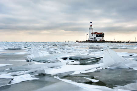 shelf ice and lighthouse  in Marken a small village near Amsterdam The Netherlandsの写真素材