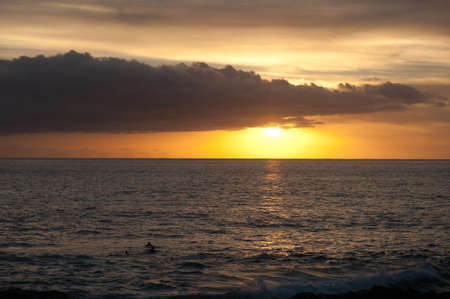 sunset and surfers in El Remo, La Palma, canary islands, spainの写真素材