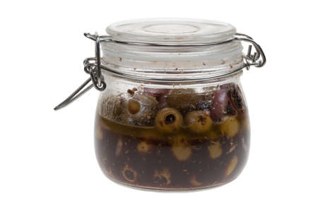 marinated olives in a jar isolated on a white backgroundの写真素材