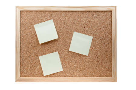 different sticky notes on a cork board isolated on a white backgroundの写真素材