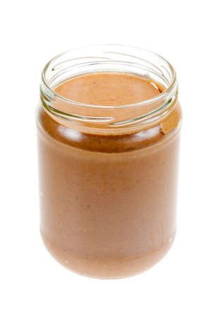Jar of peanut butter isolated on a white backgroundの写真素材
