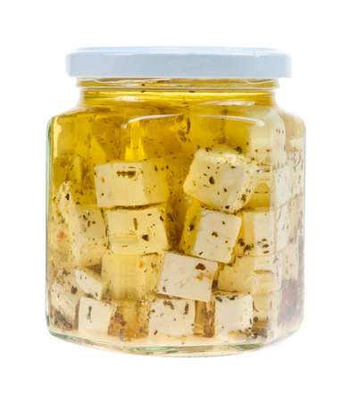 Hirtenkase or herder's cheese with oil in a jar isolated on a white backgroundの写真素材