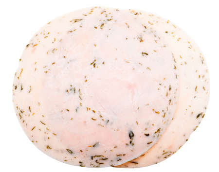 slices of chicken fillet  with herbs isolated on a white backgroundの写真素材