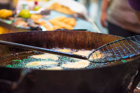 sicilian fritters fryingの写真素材