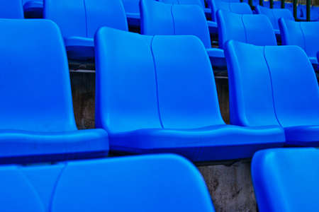 Blue plastic chairs in football stadium thailandの写真素材