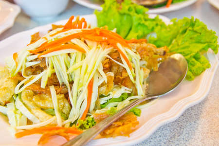 fried fish kidney and chips garnished with parsley flakes and served with side salad thai food の写真素材