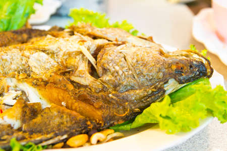 fired fish with  fresh herds delicious Thai foodの写真素材