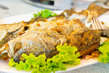 fried Fish on dish with vegetables,Style Thailandの写真素材