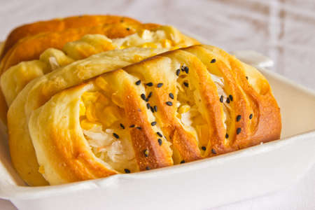 Delicious freshly Bread baked pastry filled and filling corn and coconut Thai style の写真素材