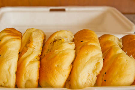 Delicious freshly Bread baked pastry filled and filling corn and coconut Thai style 