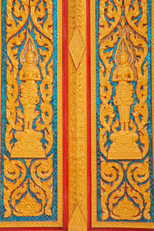 window and door wood carving in thai temple, Thailandの写真素材
