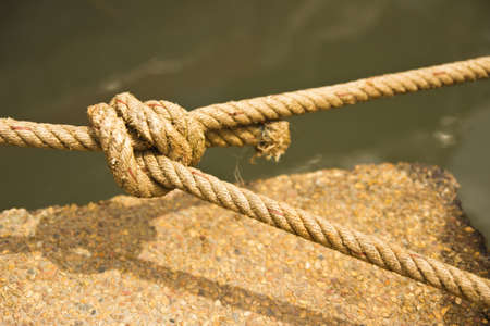 ship ropes with a knot on park boatの写真素材