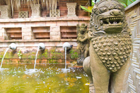 The lion statues made of stone  Stand in front of  park Garden design Thai style の写真素材