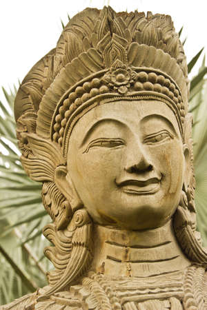 The smile female buddha wooden in Phuket of thailand の写真素材