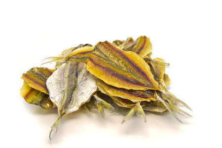 many dry medium fishes on a white backgroundの写真素材