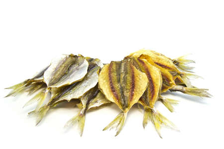 many dry small fishes on a white backgroundの写真素材