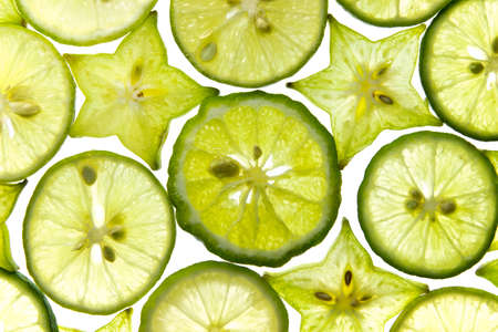 Slices of fresh fruit star with lemon isolated on white background の写真素材