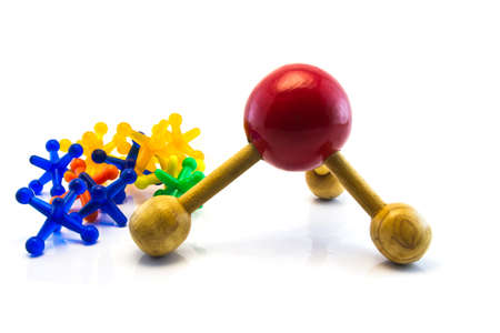 red wood and  colorful plastic toy isolated on white の写真素材