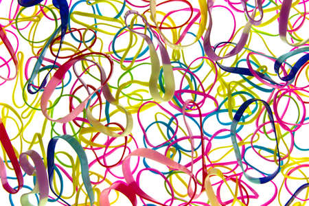 Colored rubber bands next to each other forming a backgroundの写真素材