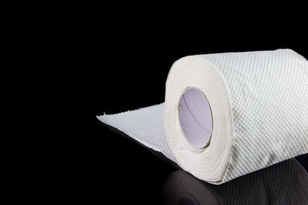 white toilet paper roll isolated on black background