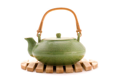 Green teapot on standの写真素材